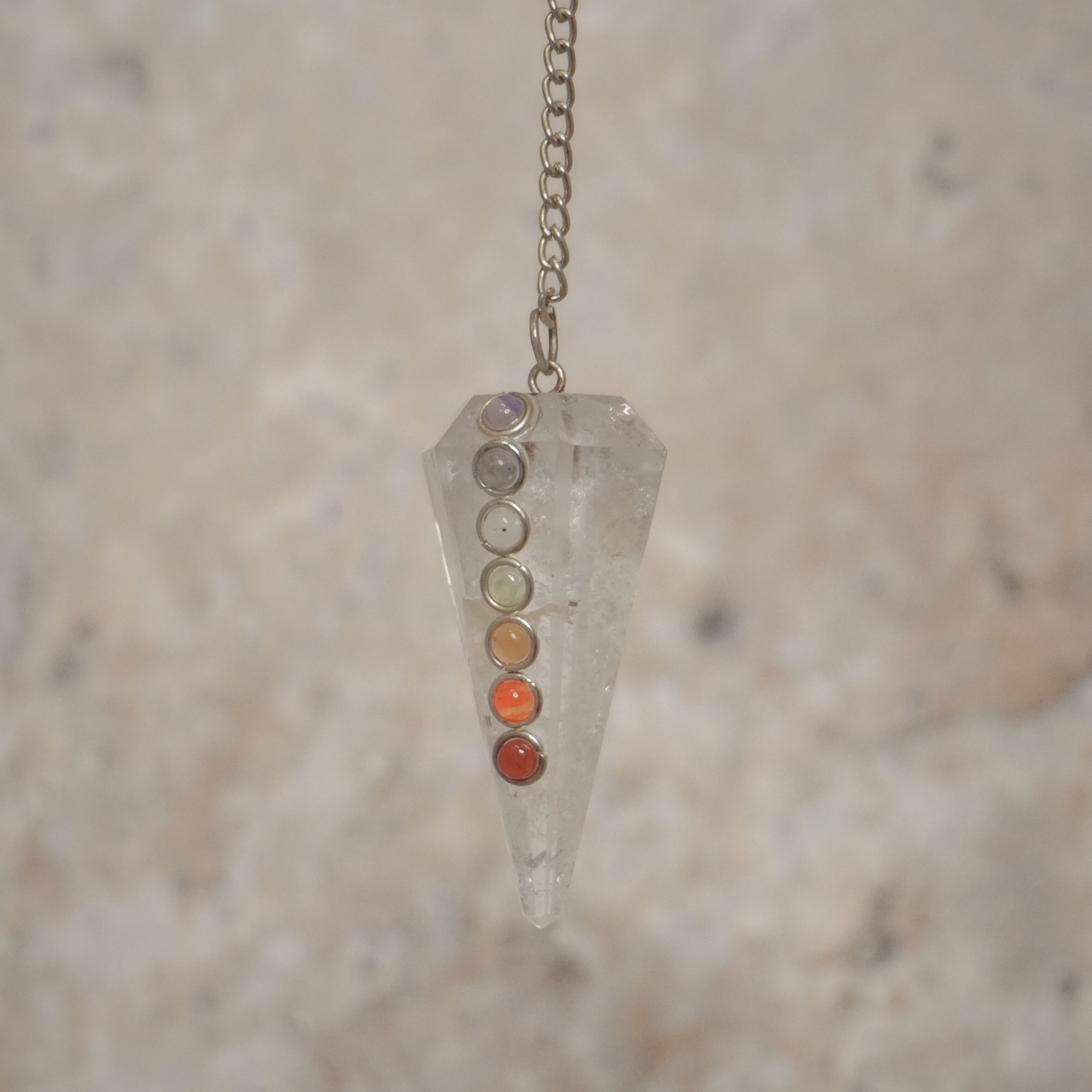 Clear Quartz Pendulum used for clarity and guidance in spiritual practices.