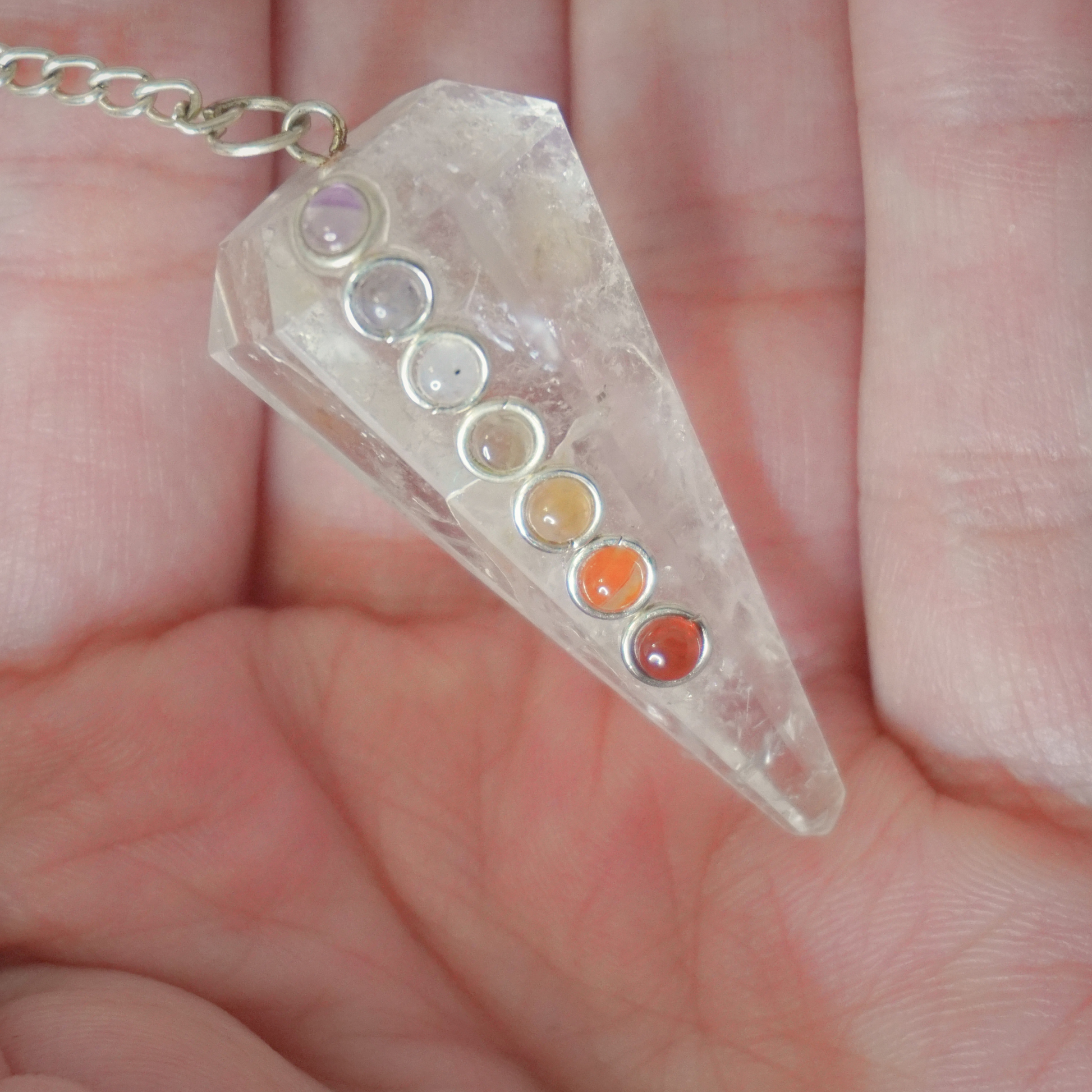 Clear Quartz Pendulum tool for dowsing, energy healing, and spiritual insight.