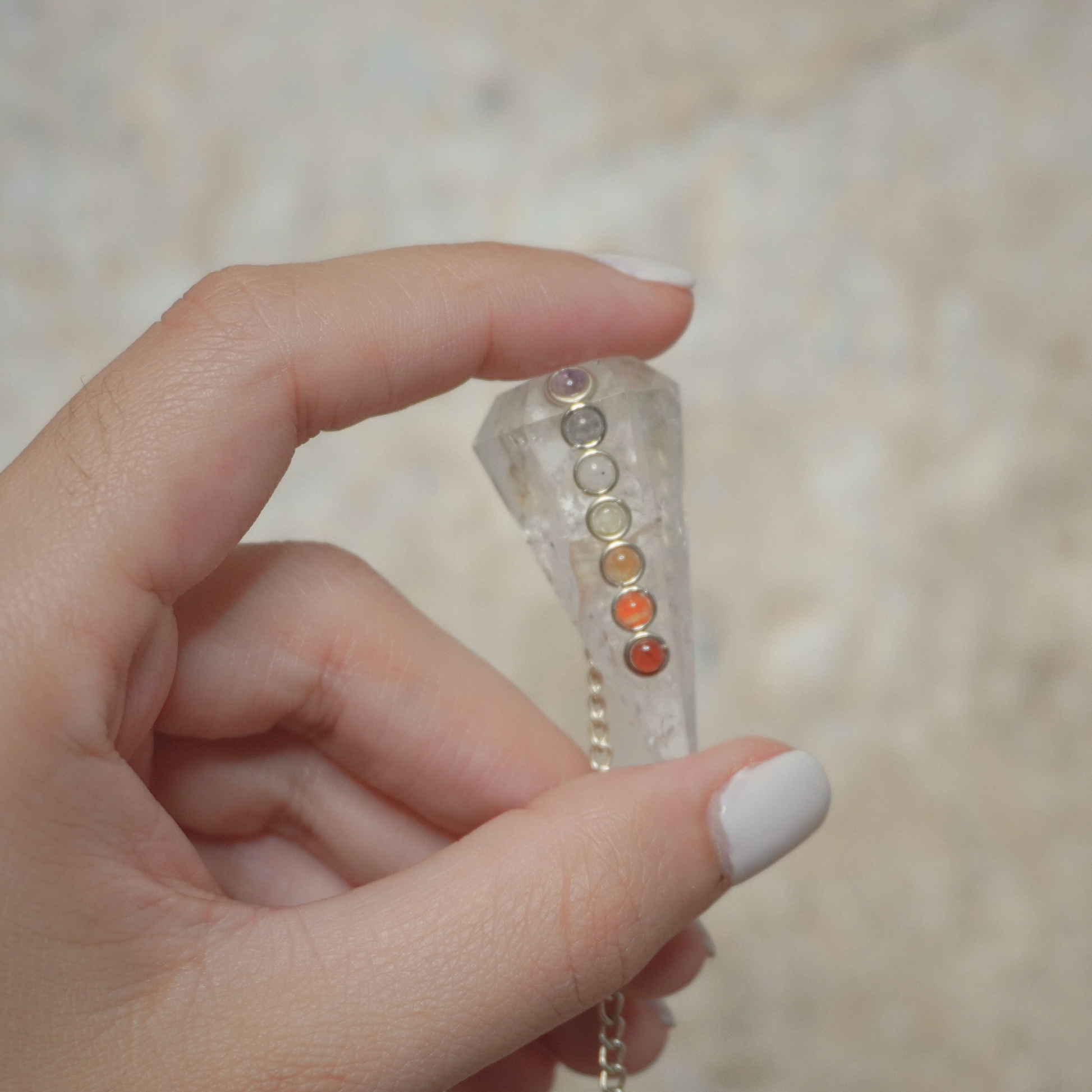 Close-up of Clear Quartz Pendulum, ideal for energy work and chakra alignment.