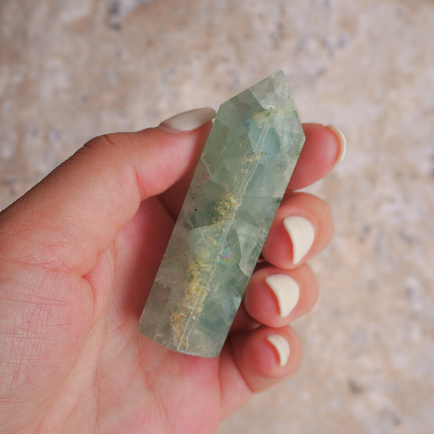 Fluorite healing crystal point for reducing stress, boosting focus, and balancing emotions naturally.