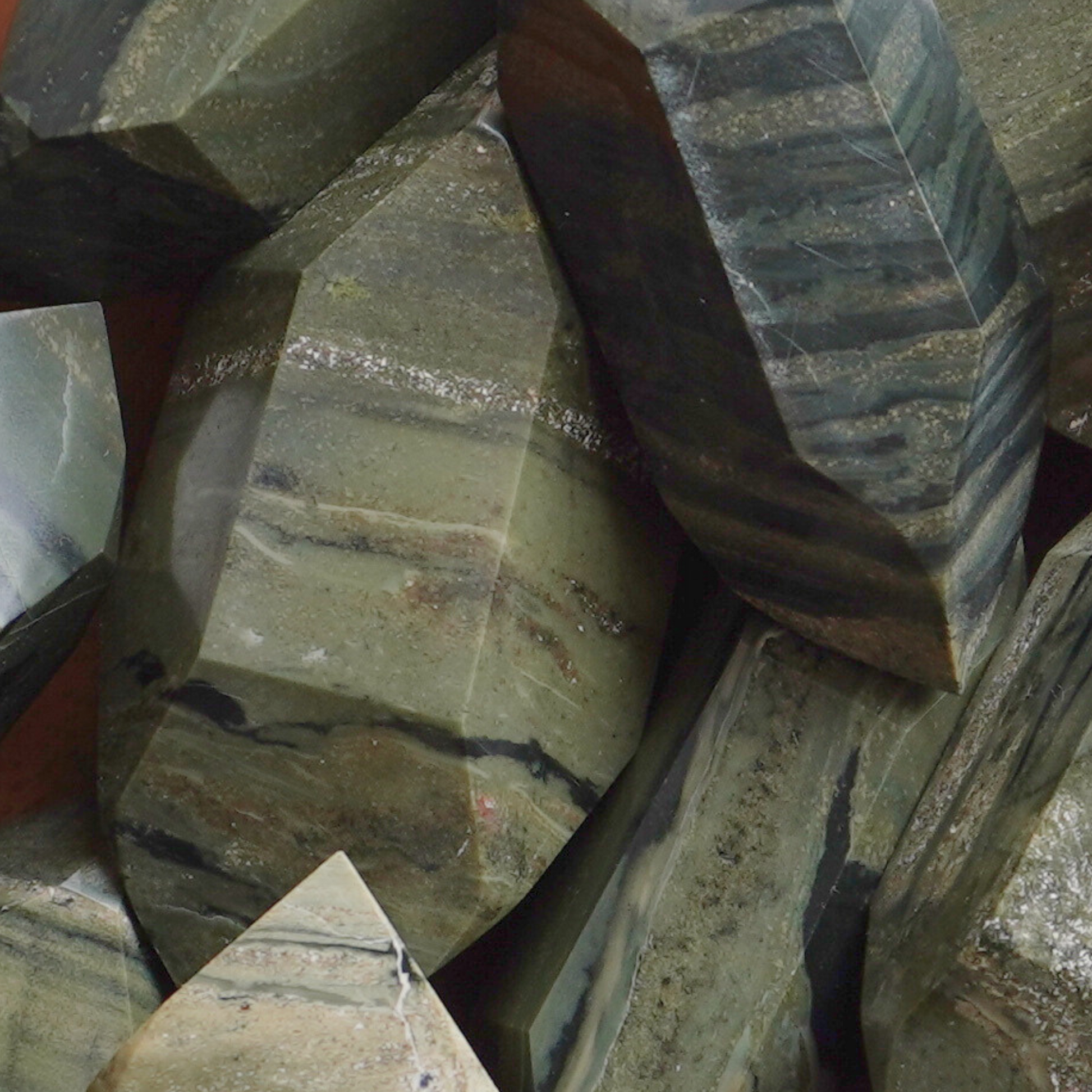 Polished Green Zebra Jasper crystal point for stability, emotional strength, and grounding energy.