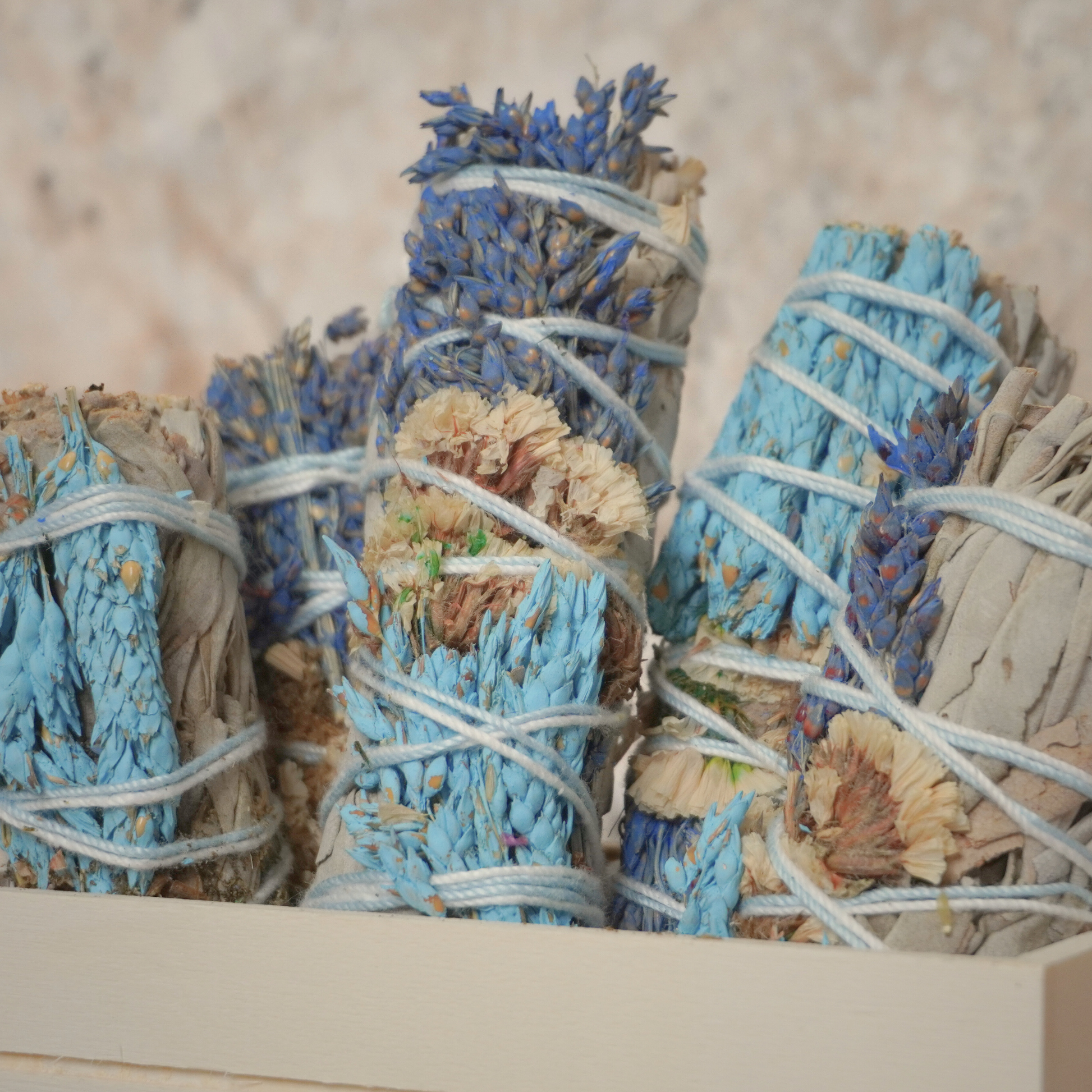 Handcrafted California white sage bundle with vibrant sinuata flowers, ideal for smudging, energy cleansing, and healing rituals. Featured by Sacred Owl Healers.