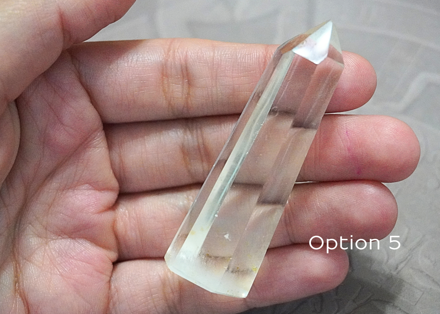 Clear Quartz Tower crystal used in spiritual practices to elevate energy and intentions.