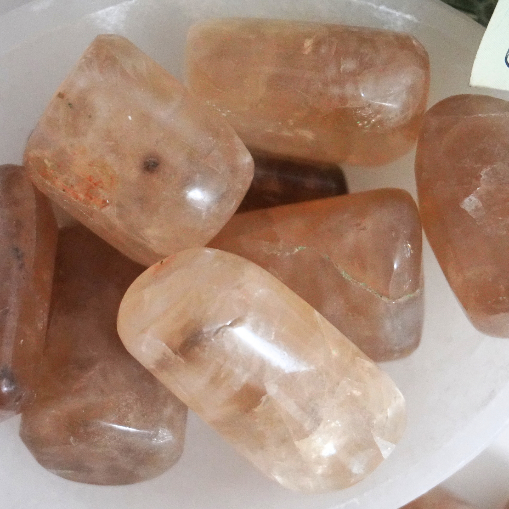 Top view of Smoky Citrine tumbles in a selenite bowl