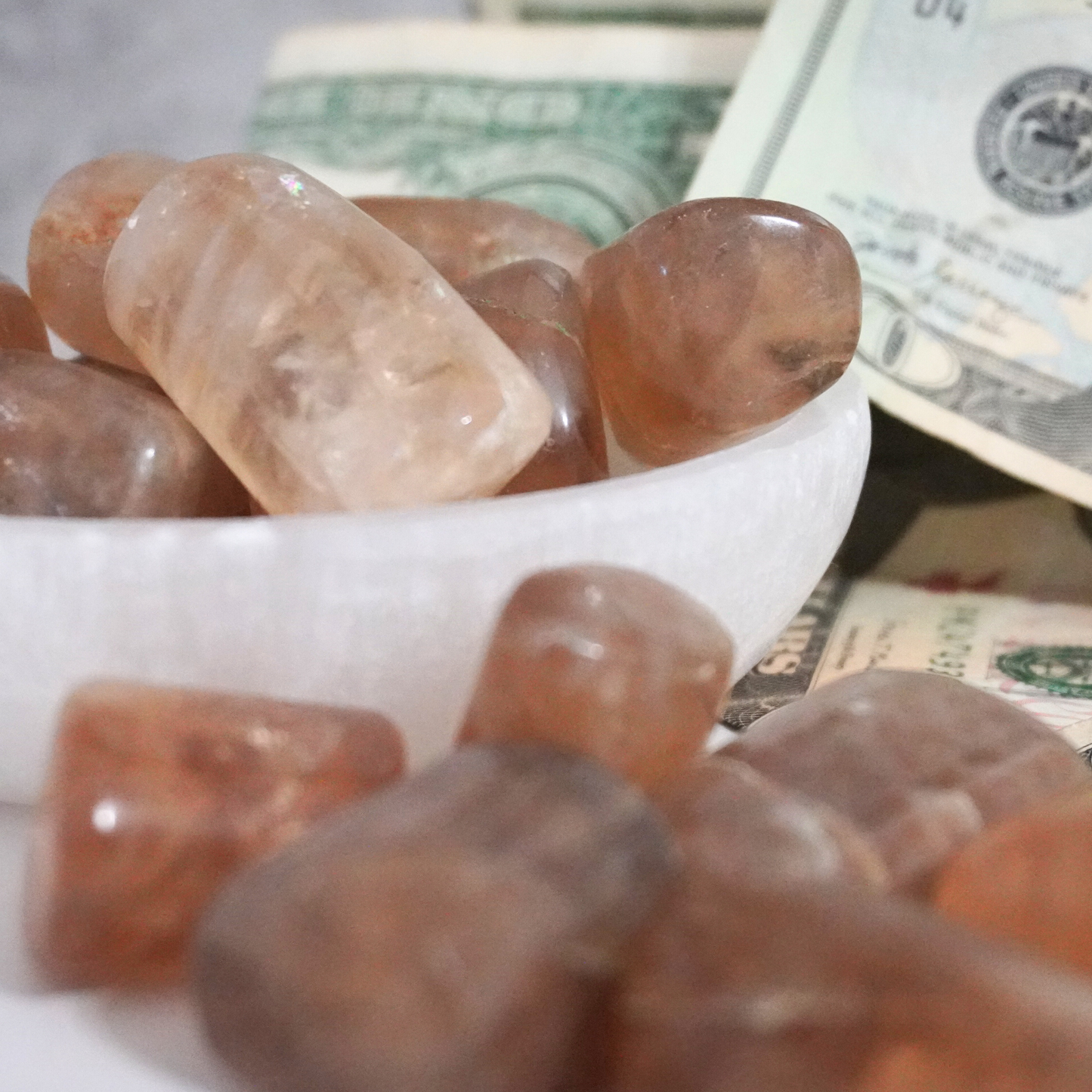 Smoky Citrine stones in a white bowl, perfect for spiritual and material success