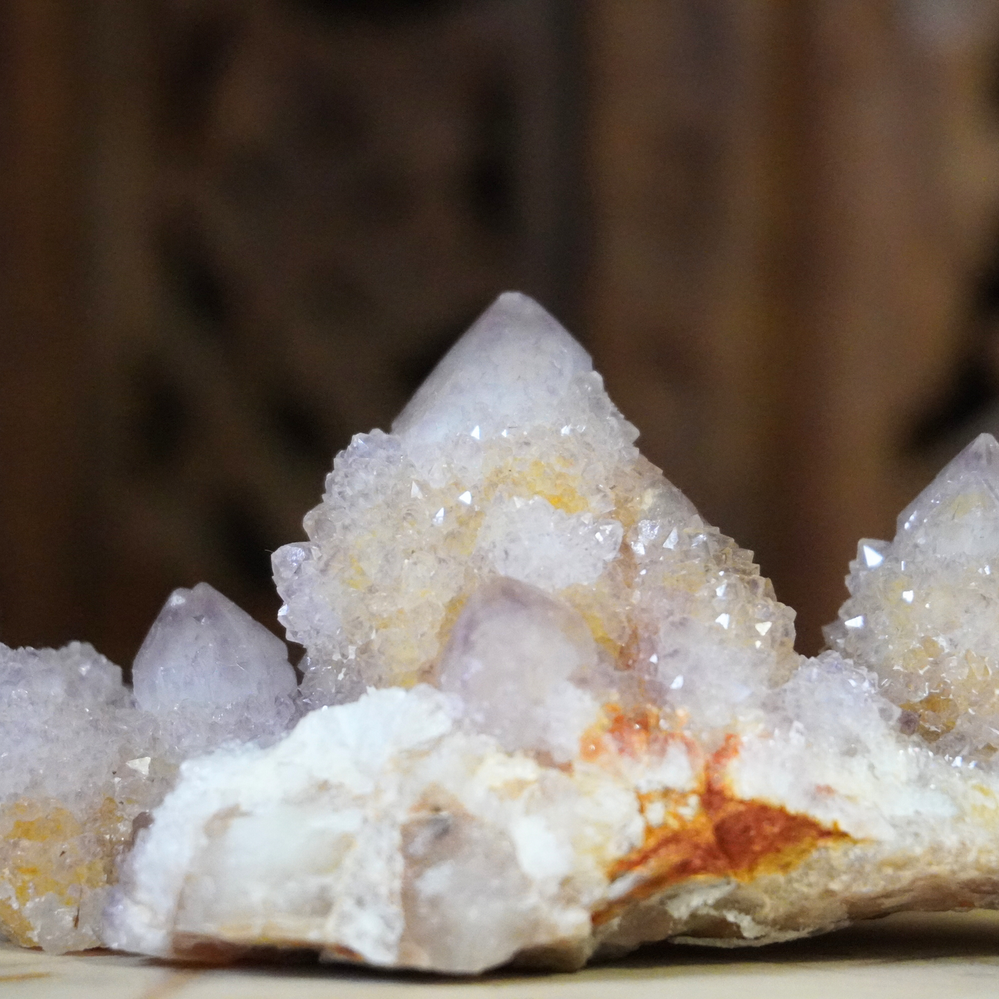 Close-up of Spirit Cactus Quartz crystal, showing its natural amethyst points and intricate details.