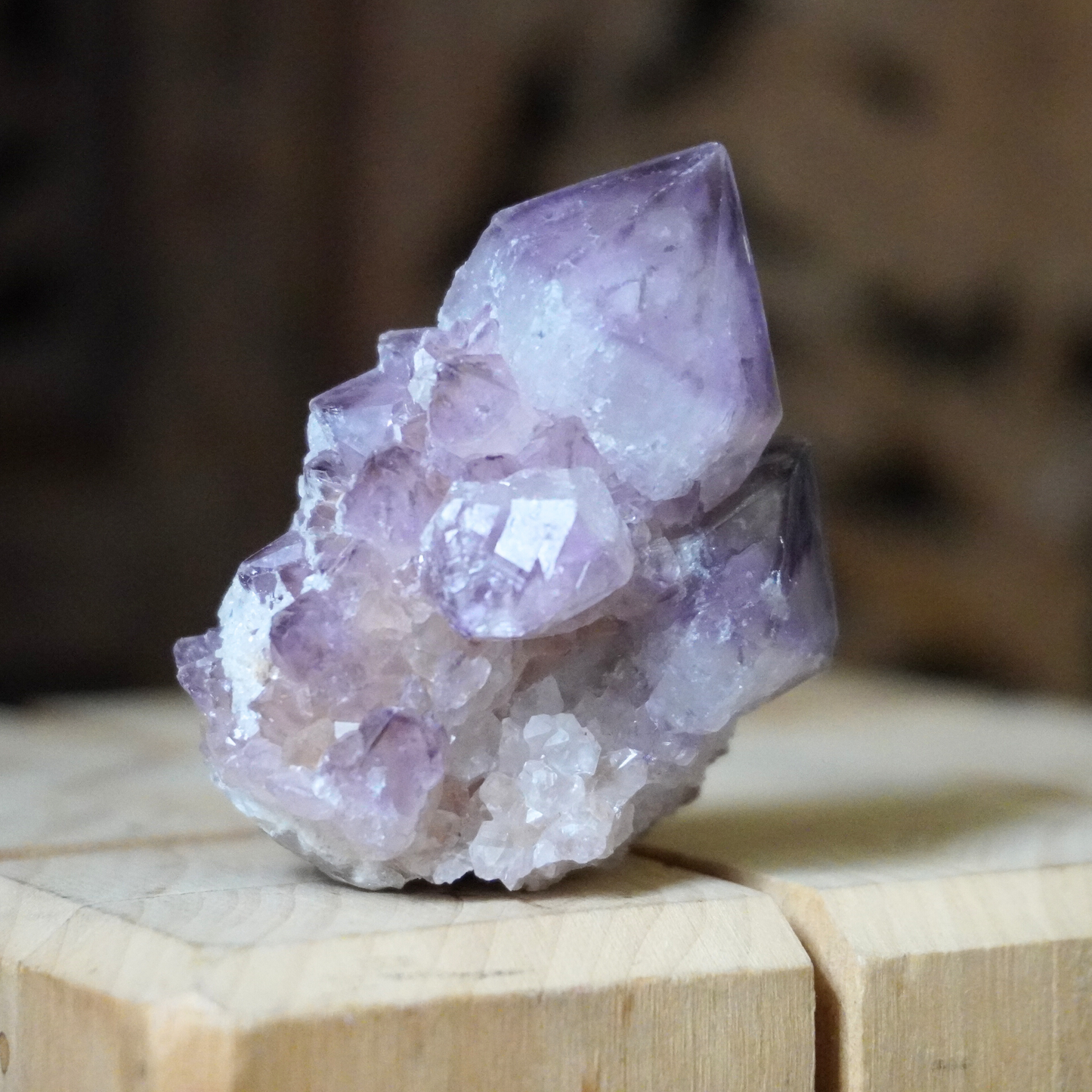 Side view of a single Spirit Cactus Quartz crystal, highlighting its unique texture and color.