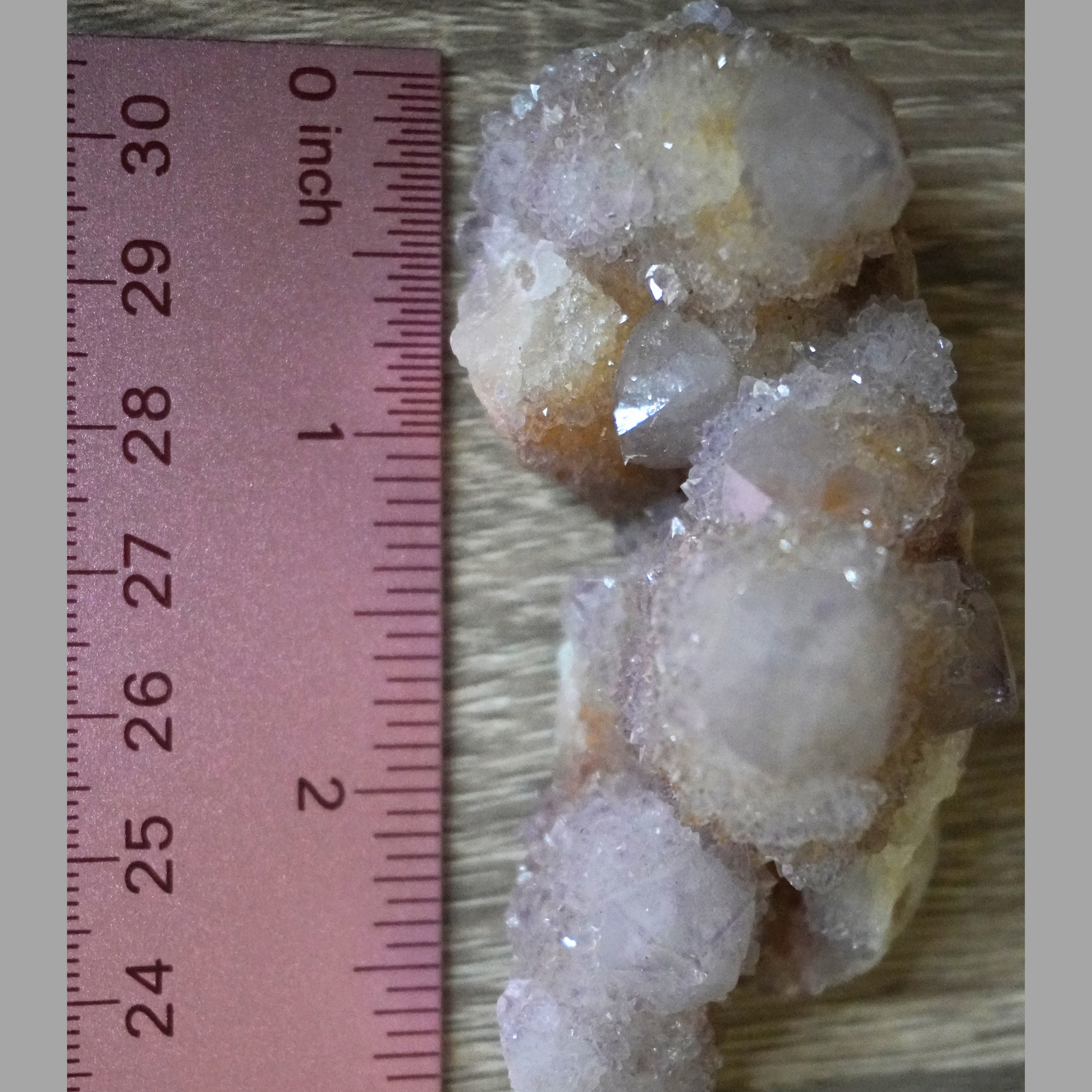 Spirit Cactus Quartz crystal being measured by a ruler, showcasing its exact size and dimensions