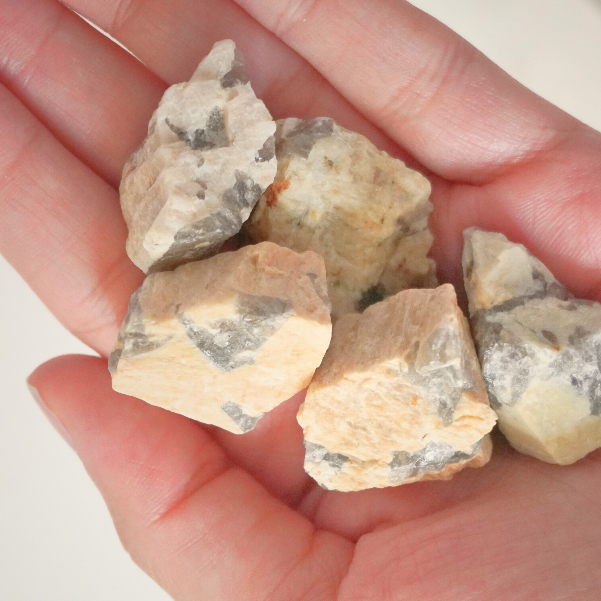 Varied pieces of Zebradorite stones, each showing different natural patterns.